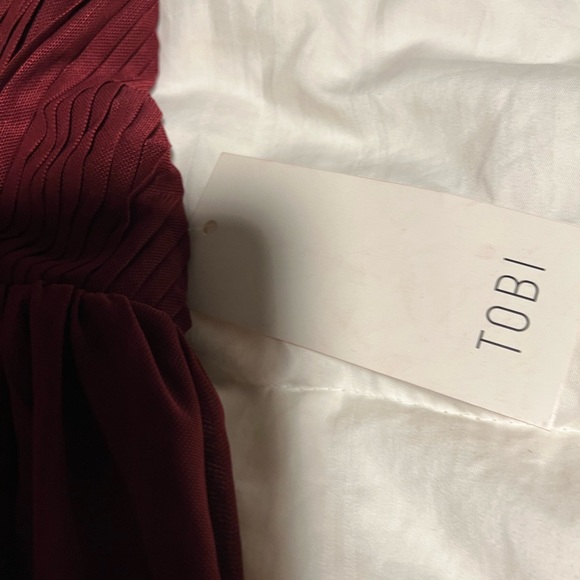 TOBI size small NWT mini dress with deep V neckline and flowy material. - Picture 3 of 4